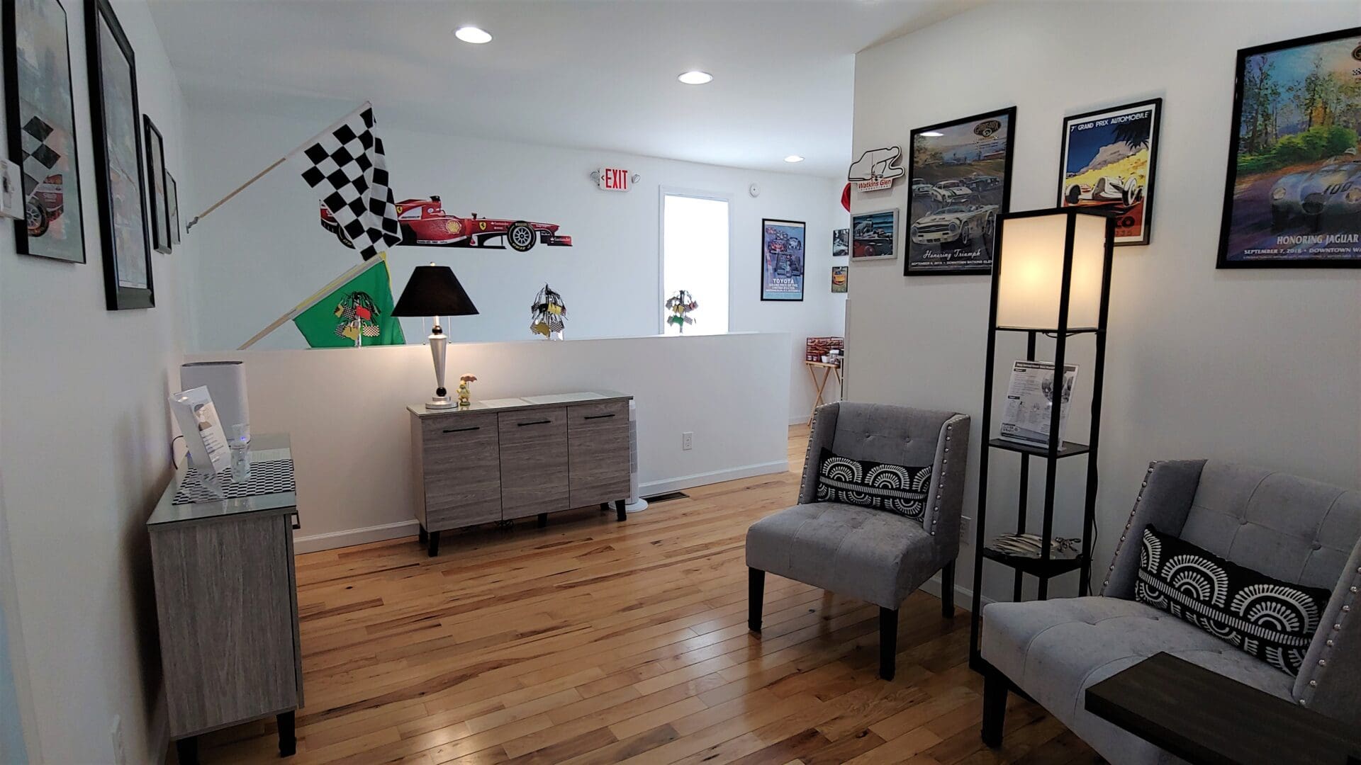 A living room with wooden floors and a chair